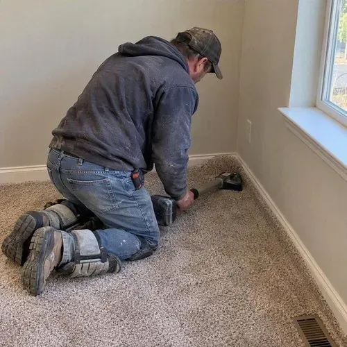 Carpet being fitted in a Waterloo townhouse bedroom