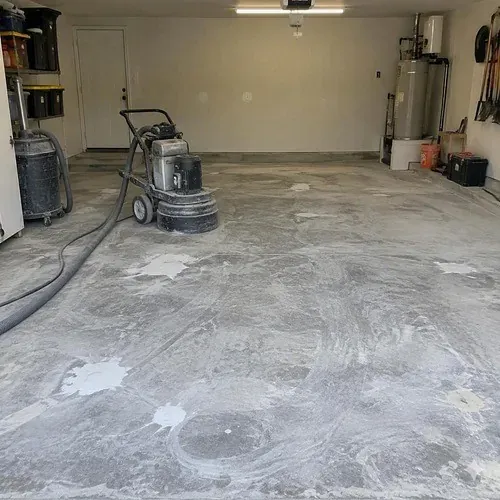 Garage slab diamond ground and patched before an epoxy floor coating