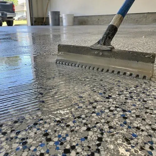Clear topcoat applied during an epoxy floor recoat