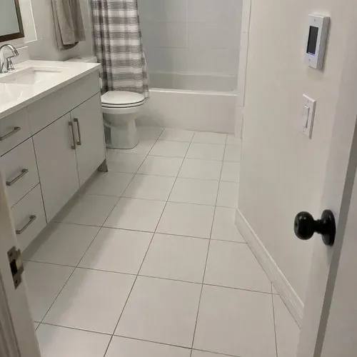 Heated tile bathroom floor with thermostat