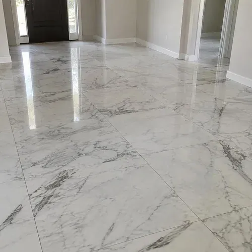 Polished white and grey marble floor installed in a Kitchener foyer